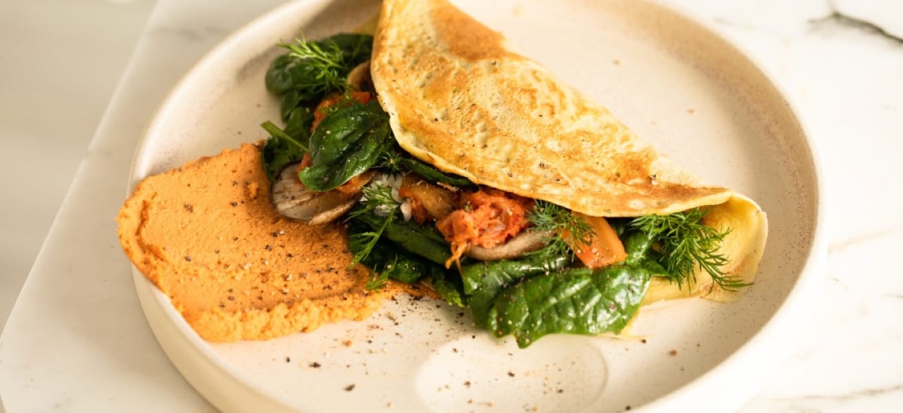 Golden omelette with filling on a plate